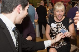 close up magician at a corporate event