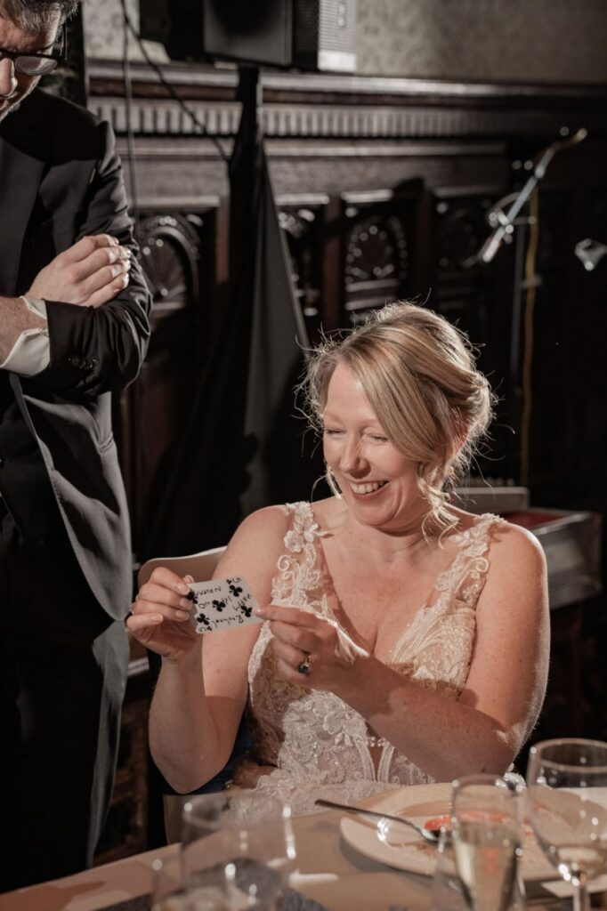 bride at wedding reacting to incredible magic trick by wedding magician ed