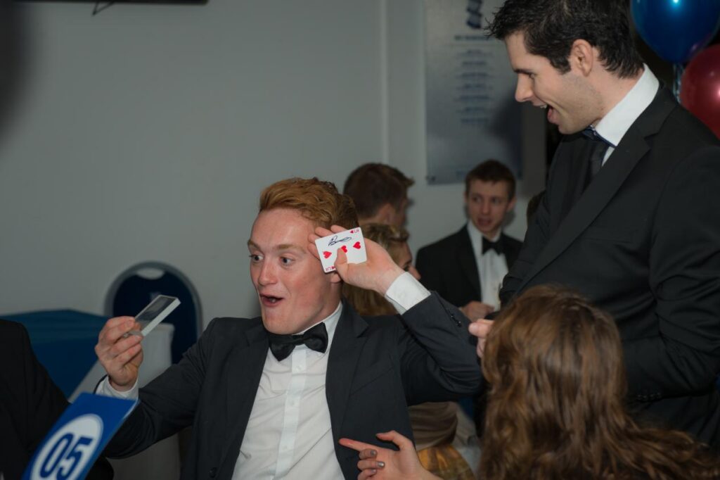 incredible reaction from a guest seeing black tie events magician perform