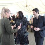 close up magician performing at a party