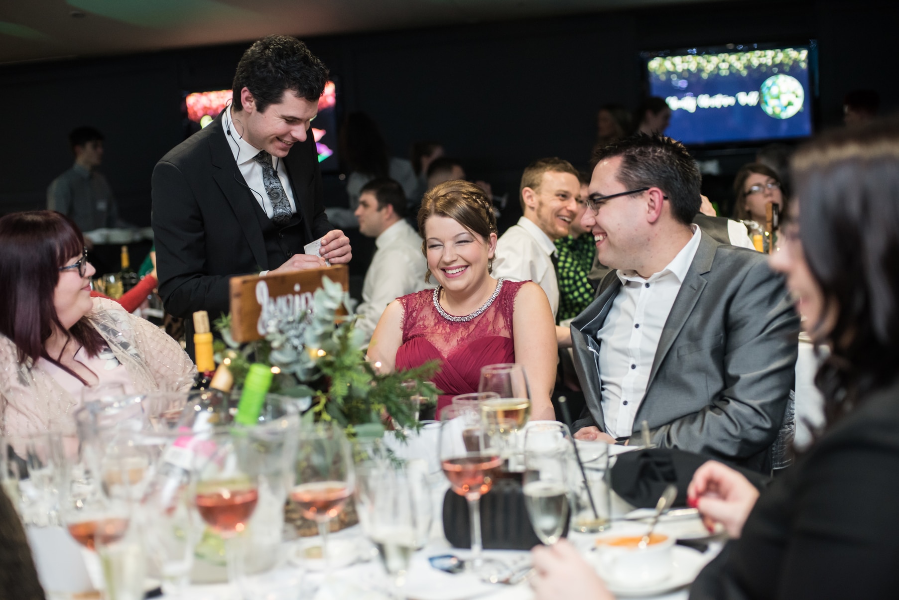 wedding magician performing at table for guests
