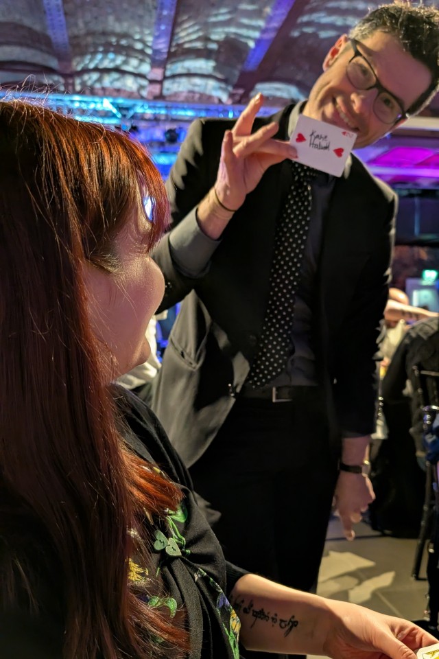 revelation of a card trick at a corporate event