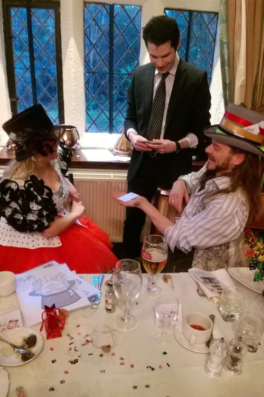 close up party magician performing at an Alice in Wonderland themed party