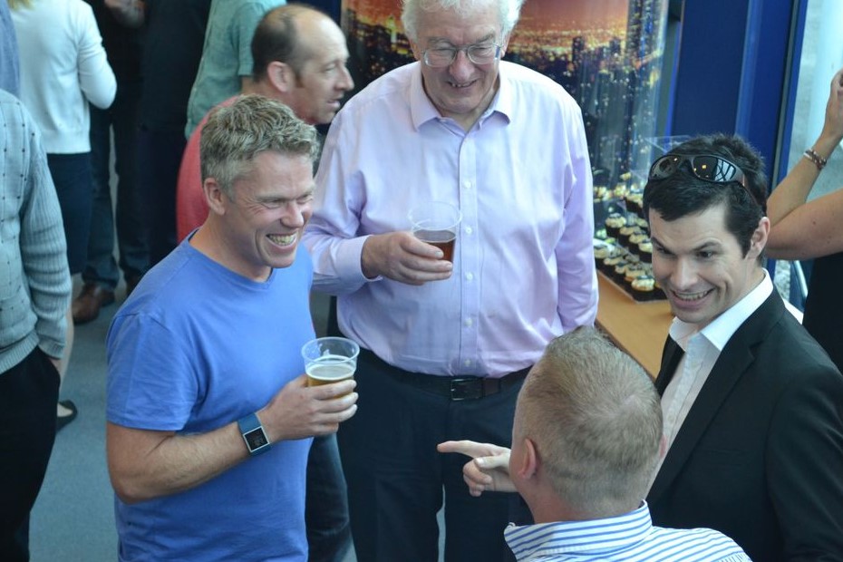 close up magician performing for a group of guests at a birmingham event