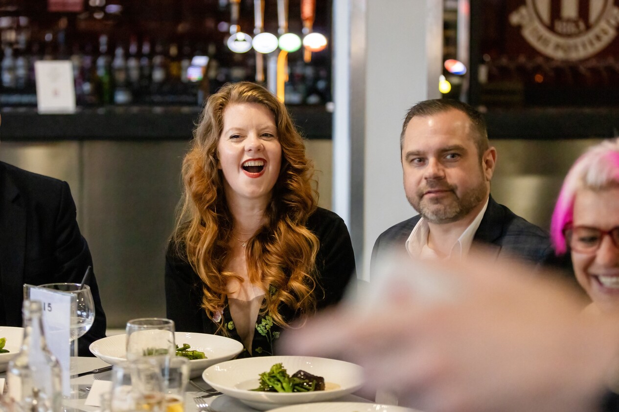 person laughing at funny close up magician