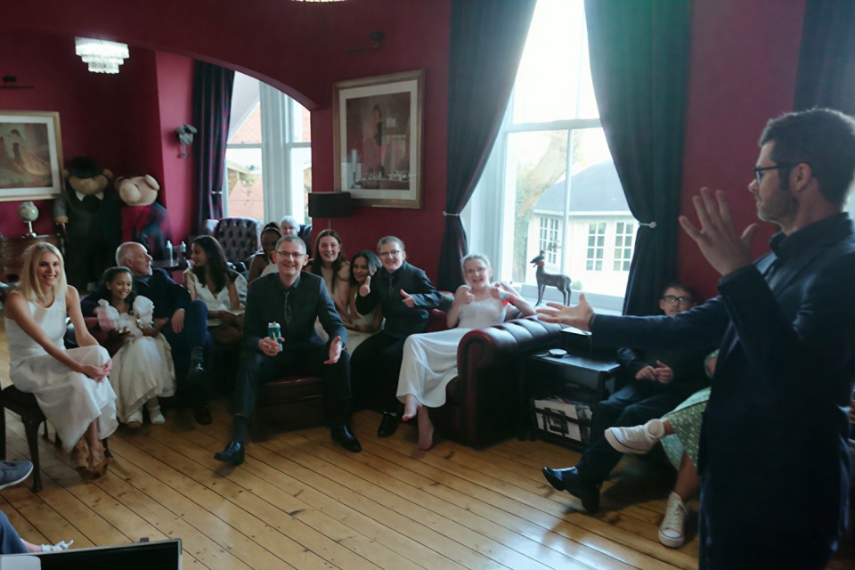 group of guests at a private party watching birmingham magician ed sumner