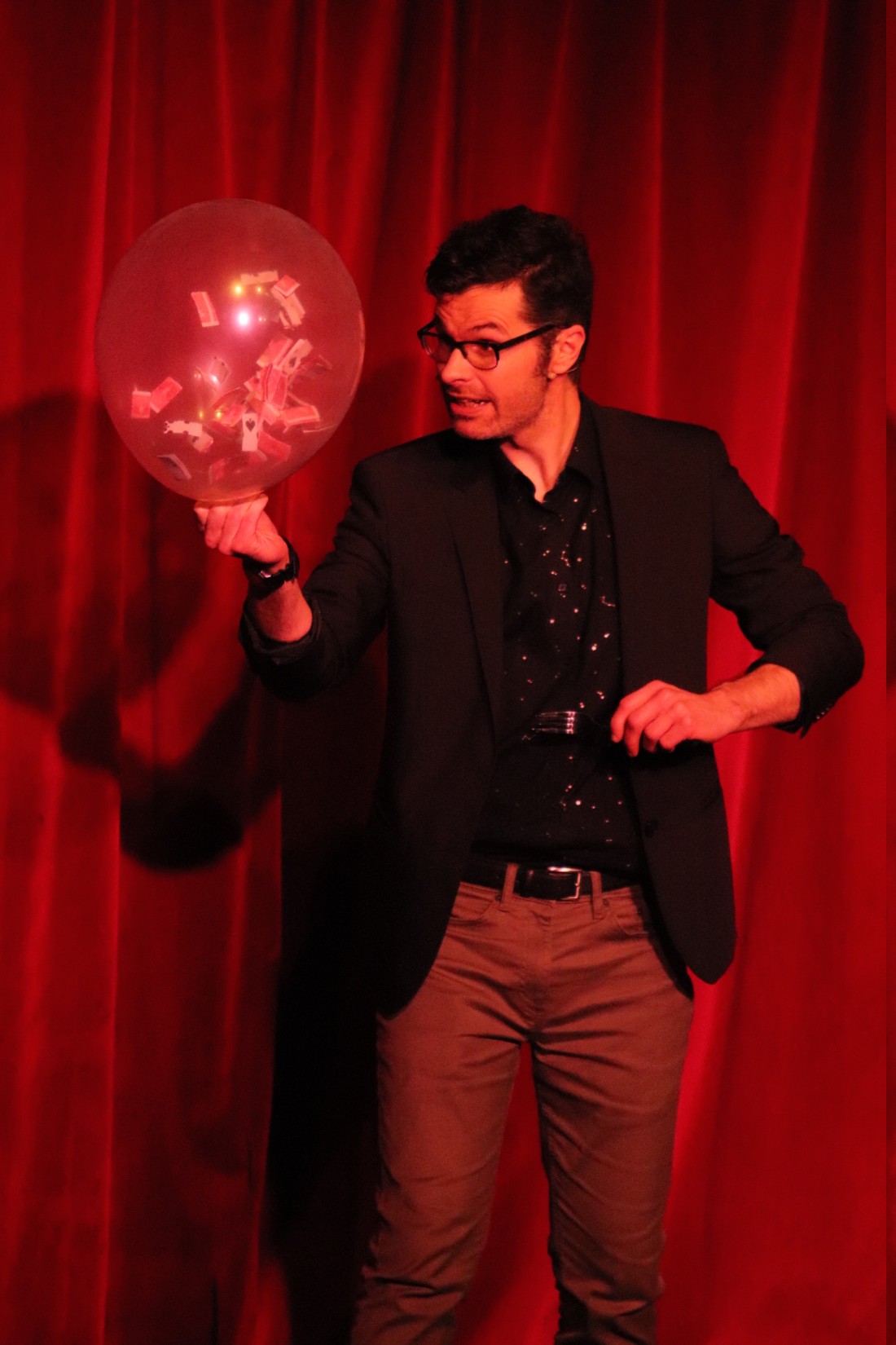 magician holding the audiences attention on stage in a christmas theatre show