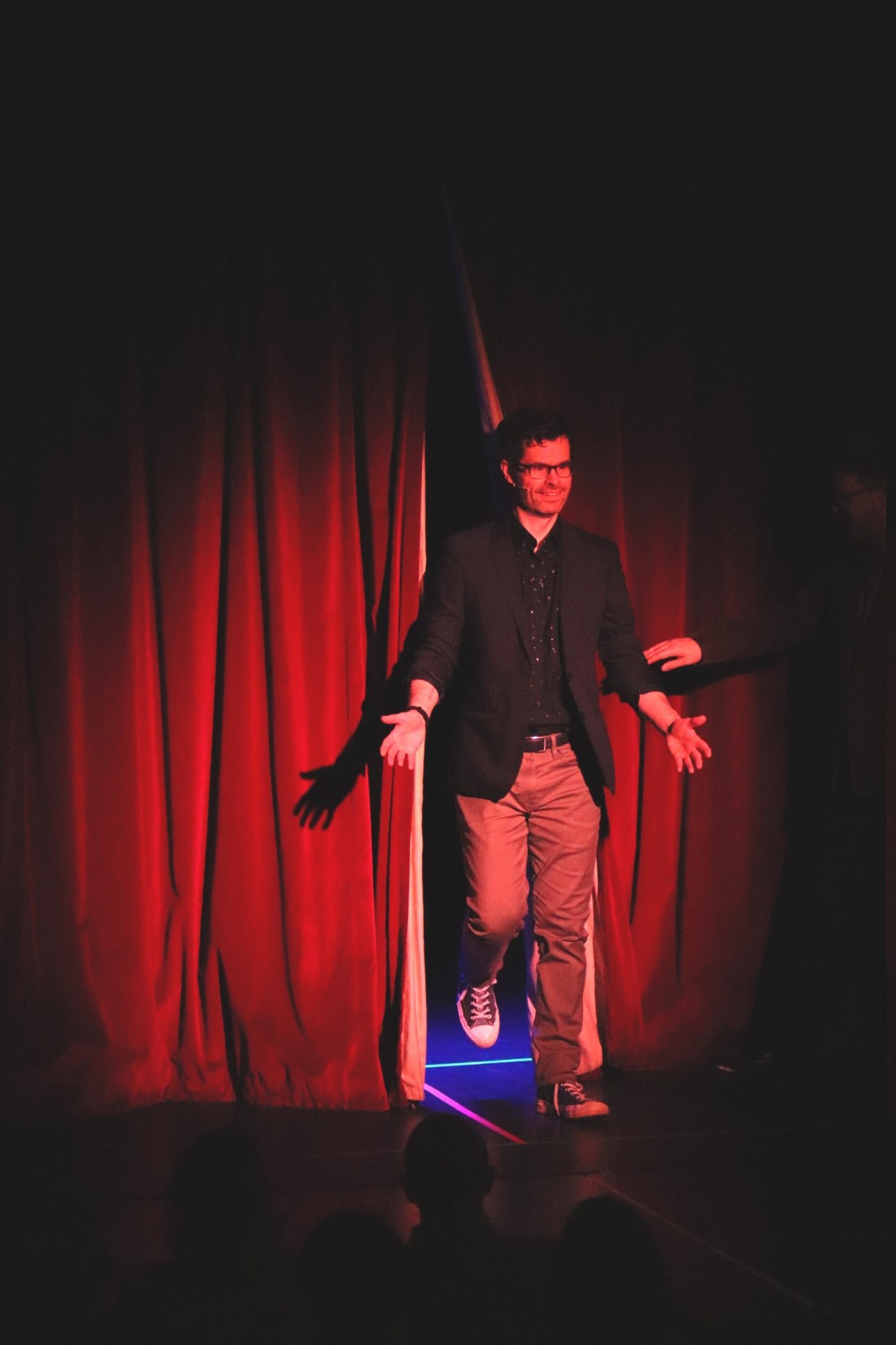 stage magician on stage in a theatre