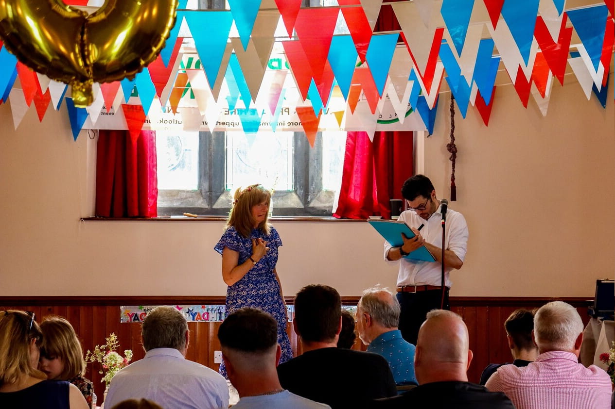 stage magician performing at a festival