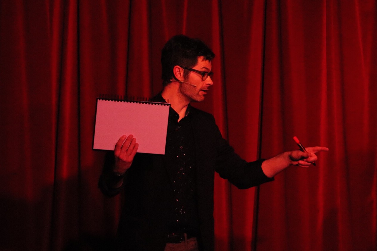 magician on stage performing mind reading
